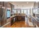 Contemporary kitchen boasts stainless steel appliances, granite countertops, and a seamless layout perfect for culinary enthusiasts at 2183 Trinity Grove Ct, Dacula, GA 30019