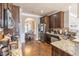 Well-equipped kitchen with granite countertops, modern appliances, and hardwood floors, seamlessly connecting to the dining area at 2183 Trinity Grove Ct, Dacula, GA 30019