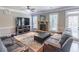 Cozy living room with a stone fireplace, ample natural light, and comfortable seating at 2183 Trinity Grove Ct, Dacula, GA 30019