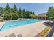 Enjoy the community pool with ample lounge chairs, perfect for relaxation and summer fun with shade trees at 2183 Trinity Grove Ct, Dacula, GA 30019