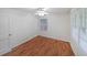 Bedroom featuring hardwood floors, ceiling fan and window allowing ample natural light at 1403 Dennis Dr, Decatur, GA 30032