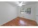 Bright bedroom with hardwood floors, a ceiling fan, and natural light at 1403 Dennis Dr, Decatur, GA 30032
