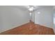 Bedroom features hardwood floors, ceiling fan and multiple access doors at 1403 Dennis Dr, Decatur, GA 30032
