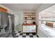 Bright kitchen features stainless steel fridge, a checkered floor, and natural light from a window at 1403 Dennis Dr, Decatur, GA 30032