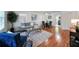 Spacious living room with hardwood floors and modern furniture, open to the dining area at 1403 Dennis Dr, Decatur, GA 30032