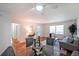 Open living room with hardwood floors, natural light, comfortable seating, and stylish decor at 1403 Dennis Dr, Decatur, GA 30032