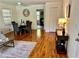 Open-concept living area featuring dining space, hardwood floors, and natural light at 1403 Dennis Dr, Decatur, GA 30032