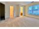 Bright bedroom with neutral carpet and large windows providing natural light at 3533 Mulberry Way, Duluth, GA 30096