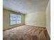 Carpeted bedroom with window featuring natural light at 3533 Mulberry Way, Duluth, GA 30096
