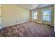 Bedroom featuring carpet, natural light, and exterior view at 3533 Mulberry Way, Duluth, GA 30096