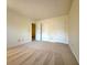 Carpeted bedroom with closet space and two doors leading to other rooms at 3533 Mulberry Way, Duluth, GA 30096