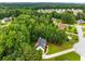 Aerial view of a neighborhood featuring well-maintained homes surrounded by mature trees at 4137 Donna Ct, Ellenwood, GA 30294