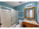 Bathroom features a stylish vanity with granite countertop and shower over tub at 4137 Donna Ct, Ellenwood, GA 30294