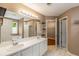 Bright bathroom with double sinks, tub, shower, and large mirror at 4137 Donna Ct, Ellenwood, GA 30294