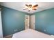 Bedroom featuring ceiling fan and a view into adjacent bathroom at 4137 Donna Ct, Ellenwood, GA 30294