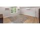 Spacious bedroom featuring a window, an area rug, and modern wall-mounted air conditioning at 4137 Donna Ct, Ellenwood, GA 30294