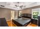 Spacious bedroom features a modern ceiling fan, bamboo floors, and lots of natural light at 4137 Donna Ct, Ellenwood, GA 30294