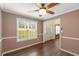 The dining room features laminate floors, a ceiling fan, and a large window at 4137 Donna Ct, Ellenwood, GA 30294