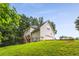 View of this house's exterior showing the deck, yard and two-car garage at 4137 Donna Ct, Ellenwood, GA 30294