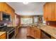 Bright kitchen with stainless steel appliances, granite countertops and lots of cabinet space at 4137 Donna Ct, Ellenwood, GA 30294