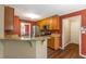 Well-lit kitchen featuring wood cabinets, granite countertops, and stainless steel appliances at 4137 Donna Ct, Ellenwood, GA 30294
