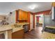 Well-lit kitchen featuring wood cabinets, granite countertops, and stainless steel appliances at 4137 Donna Ct, Ellenwood, GA 30294