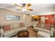 Inviting living room with neutral color walls open to the eat-in kitchen area at 4137 Donna Ct, Ellenwood, GA 30294
