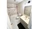 Tiled bathroom featuring a shower-tub combo with a new-looking vanity at 1435 Great Oaks Dr, Lawrenceville, GA 30045