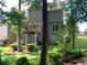 Rear exterior view of a two-story home with a deck and backyard at 1435 Great Oaks Dr, Lawrenceville, GA 30045