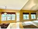 Open living area with bright windows, a doorway to a deck and a vaulted ceiling at 1435 Great Oaks Dr, Lawrenceville, GA 30045