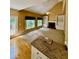 Open living area featuring built-in shelving, fireplace, vaulted ceiling, and backyard access at 1435 Great Oaks Dr, Lawrenceville, GA 30045