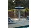 Poolside seating under a water feature in the community at 1435 Great Oaks Dr, Lawrenceville, GA 30045