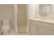 Modern bathroom featuring a glass door shower and vanity with stone countertop at 535 Brickleberry Ln, Roswell, GA 30075