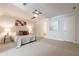 Light-filled bedroom with ceiling fan, carpet, bedside tables, and en-suite bathroom access at 535 Brickleberry Ln, Roswell, GA 30075