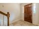 Welcoming entryway featuring a hardwood door and stylish tile flooring at 535 Brickleberry Ln, Roswell, GA 30075