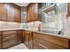 Updated kitchen features tile backsplash, granite countertops, custom cabinetry and stainless steel appliances at 535 Brickleberry Ln, Roswell, GA 30075