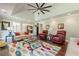 Inviting living area featuring a hardwood floor, tray ceiling, and comfortable seating at 535 Brickleberry Ln, Roswell, GA 30075