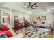Spacious living room featuring hardwood floors, tray ceiling, and comfortable seating at 535 Brickleberry Ln, Roswell, GA 30075