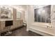 This updated main bathroom includes a soaking tub, tiled floors, vanity with double sinks and tiled shower at 535 Brickleberry Ln, Roswell, GA 30075