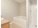 Bathroom featuring a soaking tub and a stand-up shower with neutral tile flooring at 6010 Capitol Knl, Fairburn, GA 30213