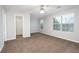 Spacious bedroom features neutral walls, carpet, and a ceiling fan, offering a serene retreat at 6010 Capitol Knl, Fairburn, GA 30213