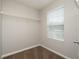 Walk-in closet features a metal shelving system and a window to provide natural light at 6010 Capitol Knl, Fairburn, GA 30213