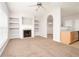 Bright open-concept living room with fireplace and easy access to the kitchen and dining area at 6010 Capitol Knl, Fairburn, GA 30213