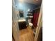 Functional bathroom with wood-look flooring, vanity, toilet, and shelving for organized storage at 95 Heartwood Xing, Dallas, GA 30157