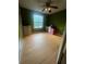Another bedroom features hardwood floors and a desk area near a window at 95 Heartwood Xing, Dallas, GA 30157
