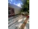 An exterior wooden deck showing aging, with peeling paint and a view of the backyard and trees at 95 Heartwood Xing, Dallas, GA 30157