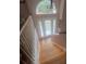 Bright entryway featuring wood staircase, large windows, and door at 95 Heartwood Xing, Dallas, GA 30157