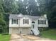 Charming home featuring a two-car garage, classic black shutters, and a welcoming front entrance at 95 Heartwood Xing, Dallas, GA 30157
