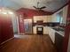 Well-lit kitchen featuring stainless steel appliances, white cabinets, and hardwood floors at 95 Heartwood Xing, Dallas, GA 30157