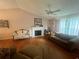 Cozy living room features a fireplace, wood floors, and comfortable seating arrangement at 95 Heartwood Xing, Dallas, GA 30157